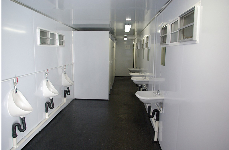 ablution container with urinals and sinks